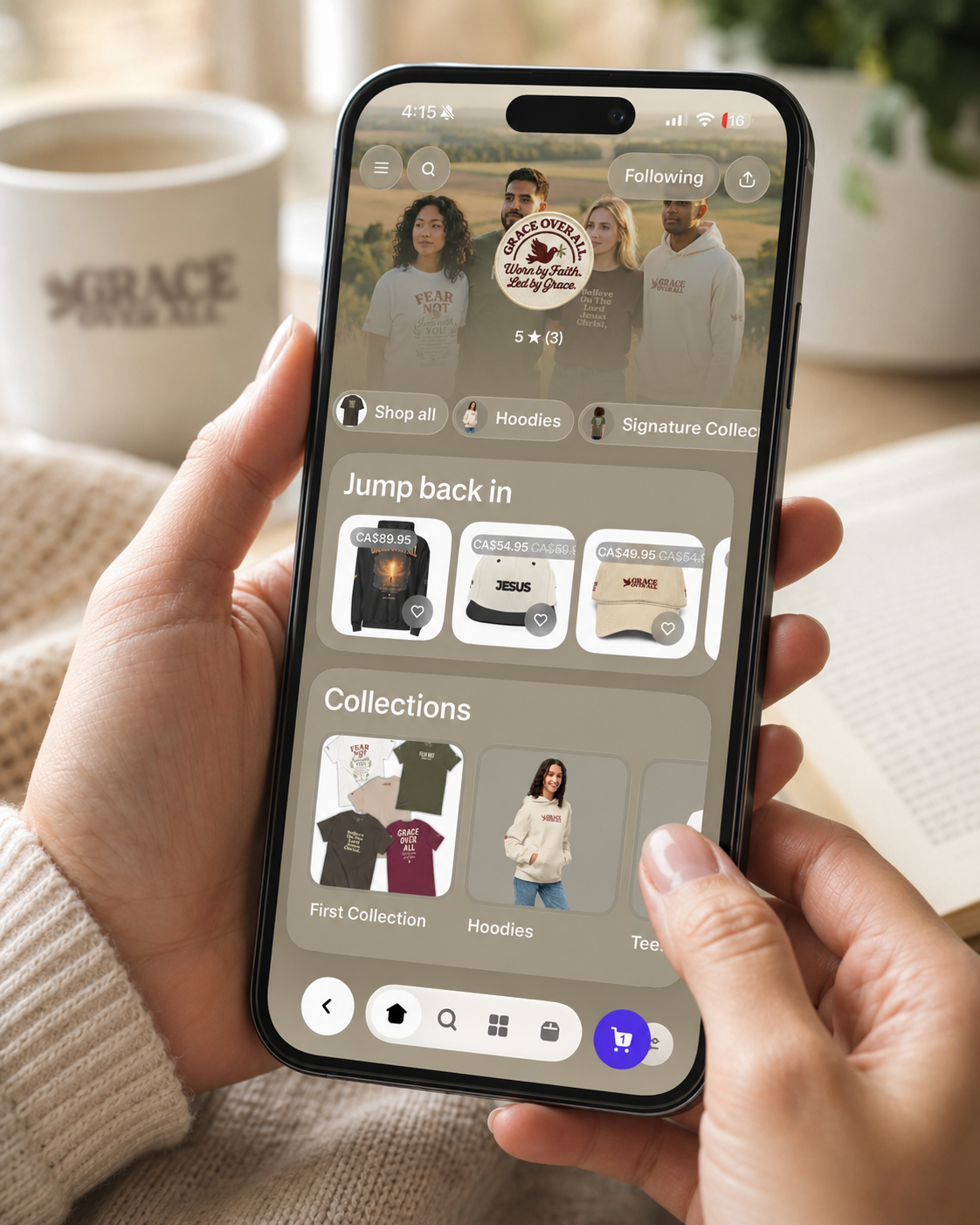 Person shopping Grace Over All™ faith-driven apparel through the Shop app on a smartphone.
